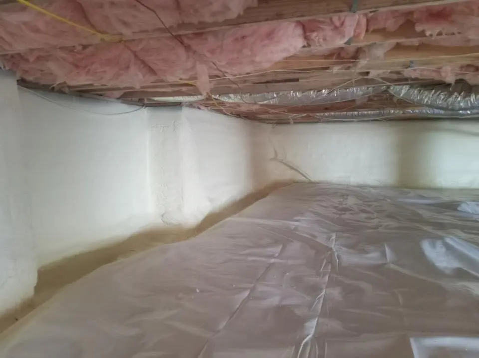Crawl space encapsulation with closed-cell spray foam for Commercial Roof Restoration in Burlington